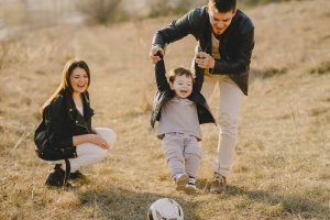 Child Kicking a Ball