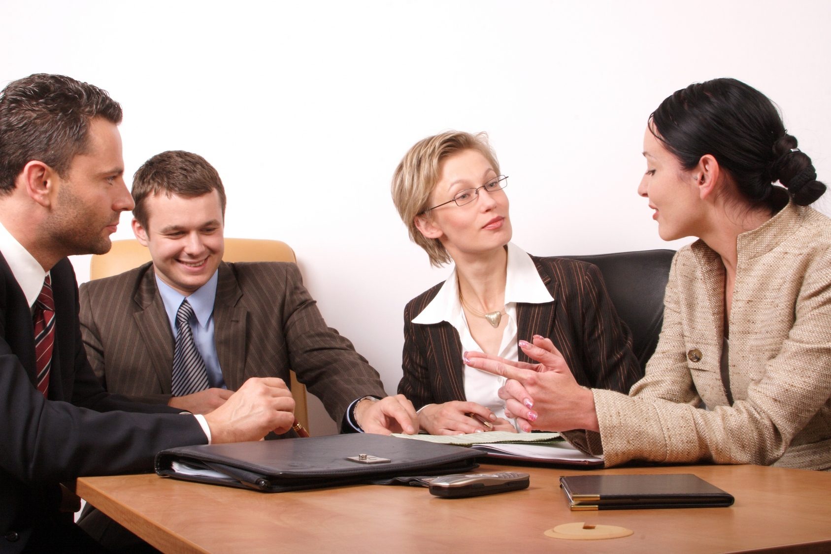 Business meeting with four professionals