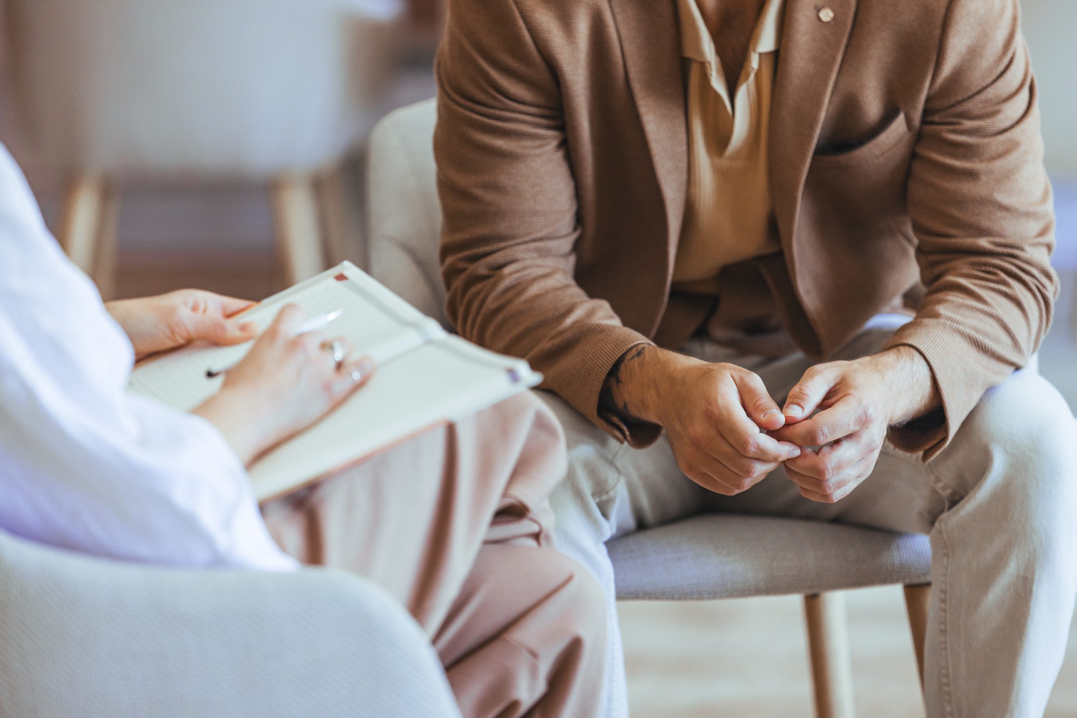 Two people talking during therapy session