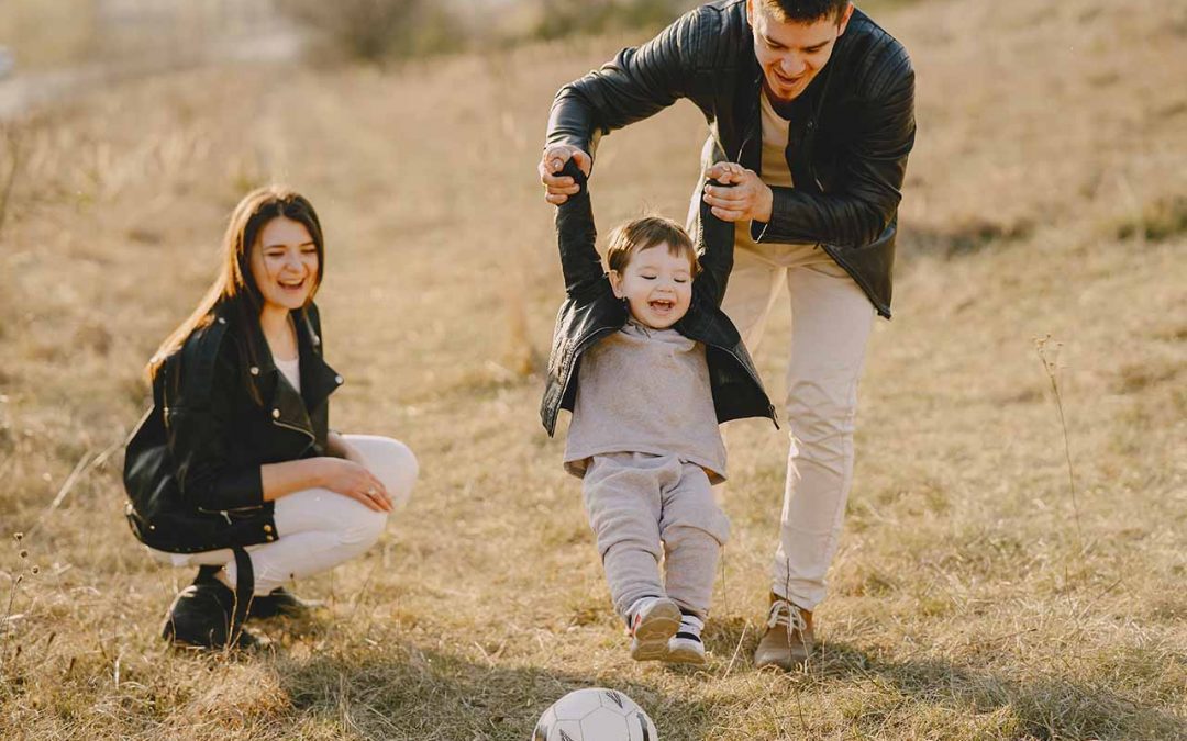 Happy family enjoying outdoor playtime