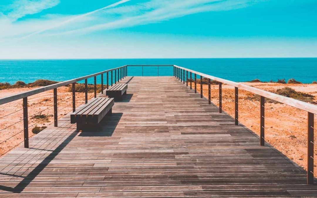 Coastal boardwalk with benches