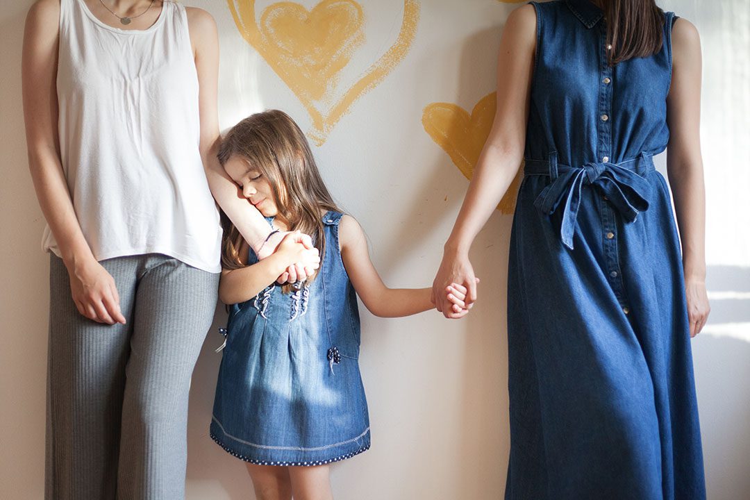 Young girl between two women